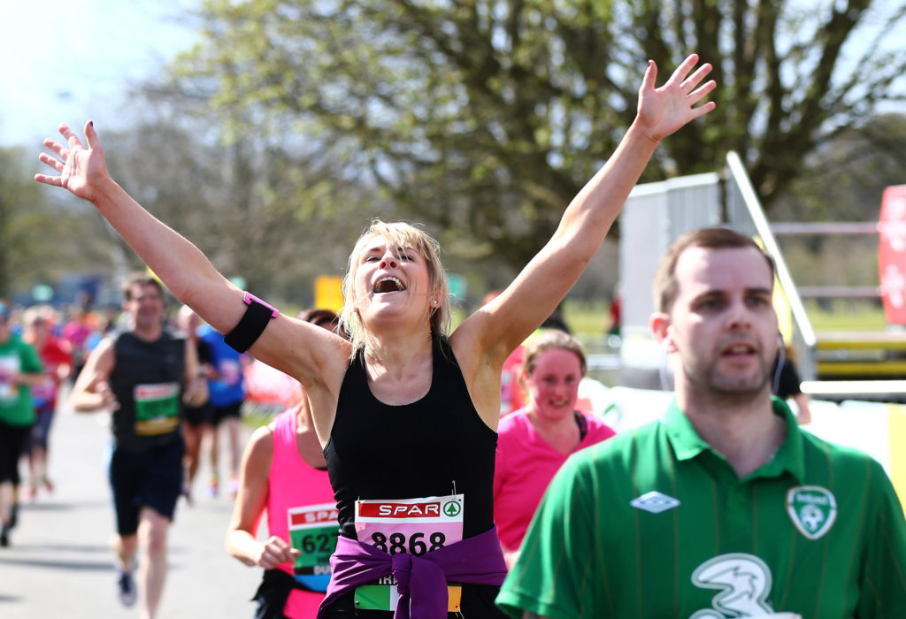 Picture of someone crossing finish line of Great Ireland Run